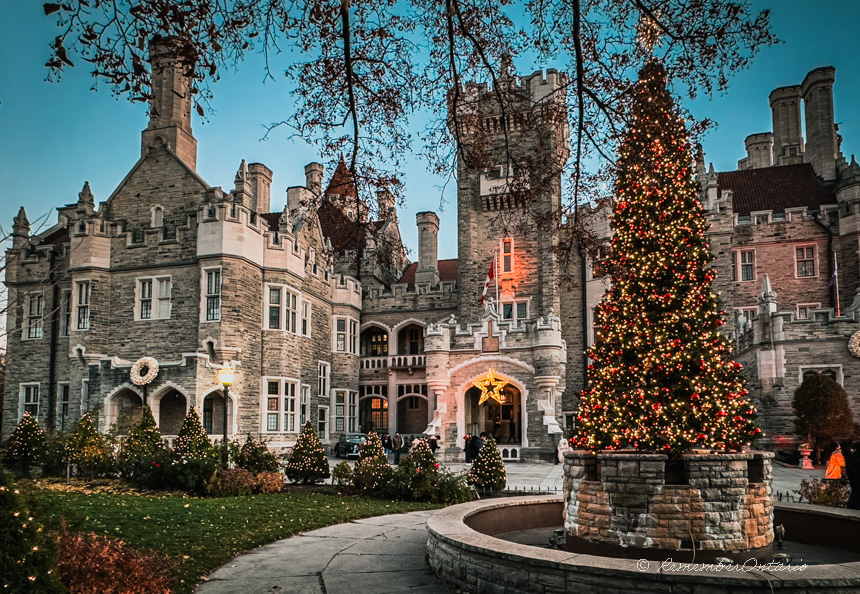 A decorated Christmas tree in the front garden of Casa Loma