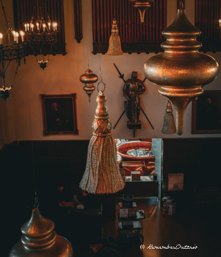 Large ornaments hang from the ceiling of the main hall at Casa Loma.