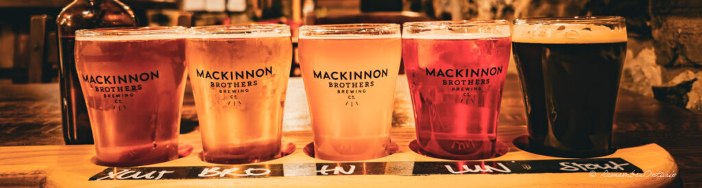 A flight of five beer and ale samplers that are brewed at Mackinnon Brothers Brewing.